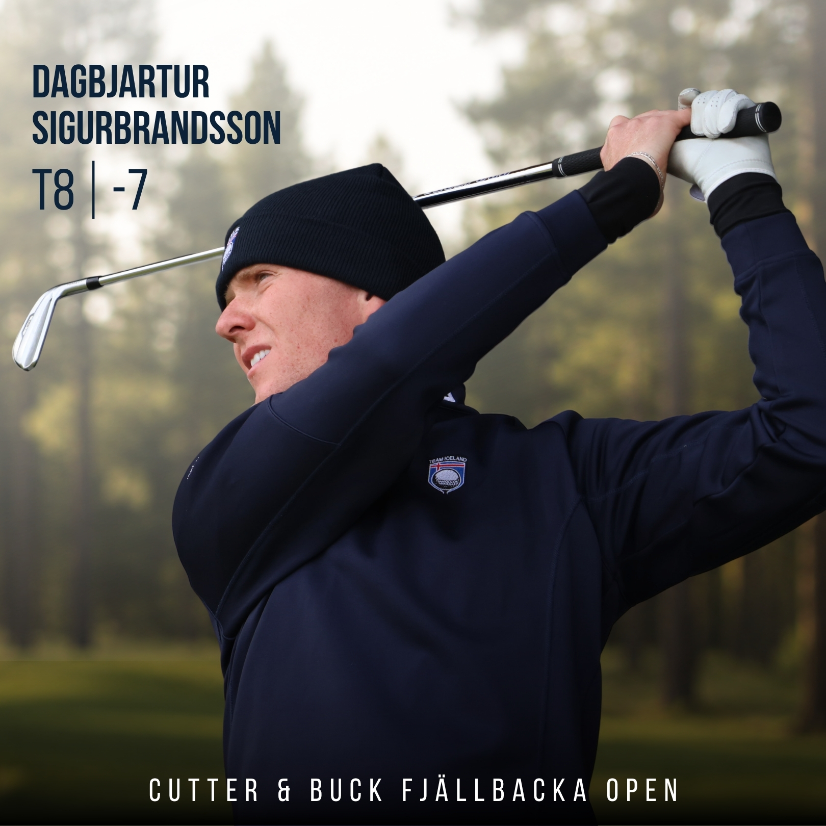 Golfer in a navy jacket and black beanie swinging a golf club, with large name and score text over a blurred forest backdrop: Dagbjartur Sigurbbrandsson T8 -7.