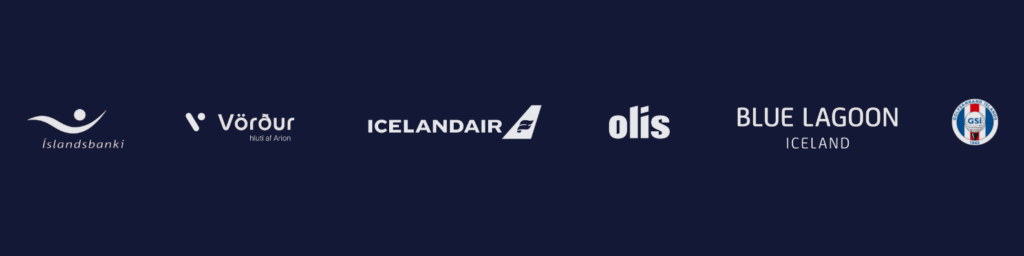 Row of white logos for Islandsbanki, Vörur, Icelandair, Olís, Blue Lagoon Iceland, and a circular seal on a dark blue background, indicating partners or sponsors.