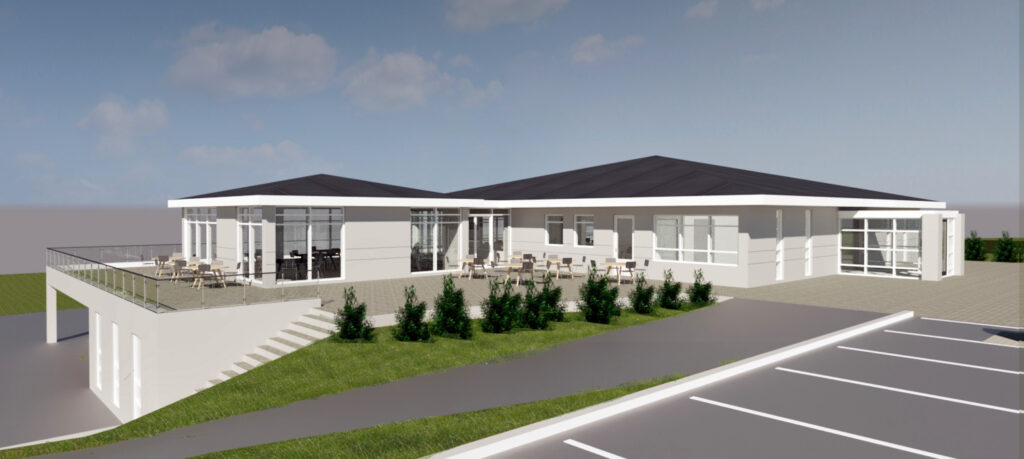 Golfskali_Keilir_Model_C5rvt_2026-May-07_11-17-17AM-000_3D_View_134_jpg-1-1024x459 - Golfsamband Íslands Modern single-story building with glass walls and a large outdoor terrace featuring seating, adjacent parking lot, and green landscaping.