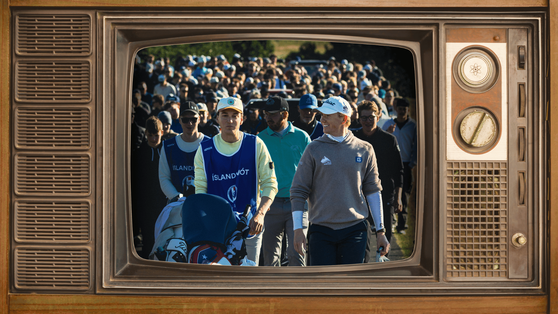 Group of runners and spectators walking toward the camera, seen through a vintage brown TV frame.